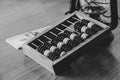 Old wooden abacus for counting money and dollars and an oil lamp nearby on a wooden table close-up black and white photo Royalty Free Stock Photo