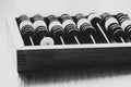 Old wooden abacus for counting money on a wooden table black and white photo Royalty Free Stock Photo