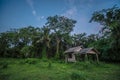 Old wooden abandoned cottage against sky