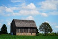 An old wooden abandoned farm barn sits on a farm field outside of Fond du Lac, Wisconsin. Royalty Free Stock Photo