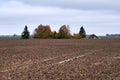 Old wooden abandoned farmstead in the middle of the field in Lithuania Royalty Free Stock Photo