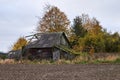 Old wooden abandoned farmstead in the middle of the field in Lithuania Royalty Free Stock Photo