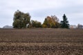 Old wooden abandoned farmstead in the middle of the field in Lithuania Royalty Free Stock Photo