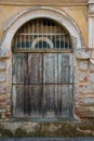 Old wooden antique door, part of an antique abandoned building