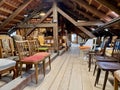 Old wooden attic with vintage chairs. Royalty Free Stock Photo