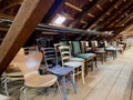 Old wooden attic with vintage chairs. Royalty Free Stock Photo