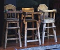 Old wooden baby highchairs in the restaurant Royalty Free Stock Photo