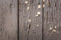 Old wooden background of boards with brown peeling cracked paint. Texture of aged painted wood Royalty Free Stock Photo