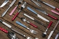 Old wooden background with a collection of cutlery composed with Royalty Free Stock Photo