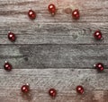 Old wooden background. Red balls, text space, top view Royalty Free Stock Photo