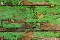 Old wooden background texture of boards with cracked green paint. table. Autumn yellow brown fallen leaves on shabby Royalty Free Stock Photo