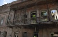 An old wooden balcony of an aged semi-destroyed building in Ajemian street, Gyumri, Armenia.