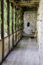 Old wooden Balcony and stone walls
