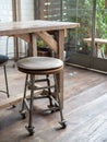 Old wooden bar stools on wooden floor in cafe retro style Royalty Free Stock Photo