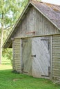 Old wooden barn with basketball ring on it
