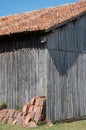 old wooden barn with a canal tile roof