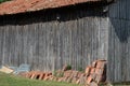 old wooden barn with a canal tile roof