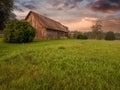 Old wooden barn in country side. Rural area in Latvia. Place for storage made of wood, simple construction local material. Living Royalty Free Stock Photo