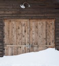 Old wooden barn door with light Royalty Free Stock Photo