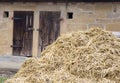 Old wooden barn doors with a haystack Royalty Free Stock Photo