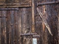 Closing details of an old wooden barn door Royalty Free Stock Photo