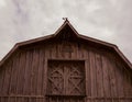 Old wooden barn. Village life background. The roof and window