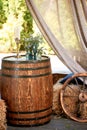 An old wooden barrel with floral decor.Photo zone for a photo shoot in the village style.