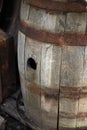 Old wooden barrel with hole and iron rims Royalty Free Stock Photo