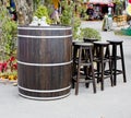 Old wooden barrel with wood stool bar