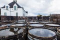 Old wooden barrels and casks with single malt Scotch at whisky distillery in Scotland Royalty Free Stock Photo