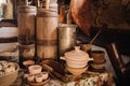 Old wooden barrels and dishes on the table in the village. Rustic antique tableware Royalty Free Stock Photo