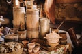 Old wooden barrels and dishes on the table in the village. Rustic antique tableware Royalty Free Stock Photo