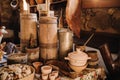 Old wooden barrels and dishes on the table in the village. Rustic antique tableware Royalty Free Stock Photo