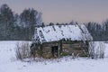 Old wooden bath with holes in the roof in winter Royalty Free Stock Photo