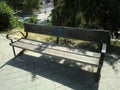 Old wooden bench with rusty screws on a spring day