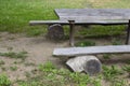 Old wooden bench and table made of solid round timber, outdoor recreation