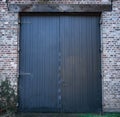 Old wooden blue door in a farm Royalty Free Stock Photo