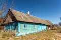 Old wooden blue house in village