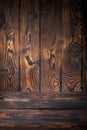 Old wooden board with scratches background texture, brown cutting board with burnt spots Royalty Free Stock Photo