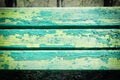 Old wooden boards with green paint. A bright background. Texture of cracked paint. Royalty Free Stock Photo