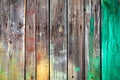 Old wooden boards with nails, green and yellow paint stains on natural texture wood plank. Royalty Free Stock Photo