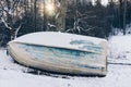 Old wooden boat ashore in winter Royalty Free Stock Photo