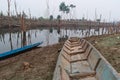 Traditional long wooden boat for fishing and transportation by river in Laos Royalty Free Stock Photo