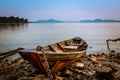 Old wooden boat with blue river Royalty Free Stock Photo