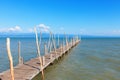 Old wooden boat dock, going far out to sea.