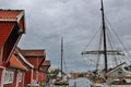 Old wooden boat houses and sailing boats in Haugesund, Norway. Royalty Free Stock Photo