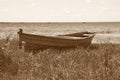 Old wooden boat on the lake bank Royalty Free Stock Photo