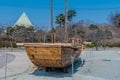 Old wooden boat at lakeside park