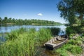 Old wooden boat by the river, beautiful scenery Royalty Free Stock Photo