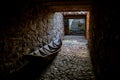 Old boat on stone paving. The concept of unfulfilled hopes, unfulfilled plans